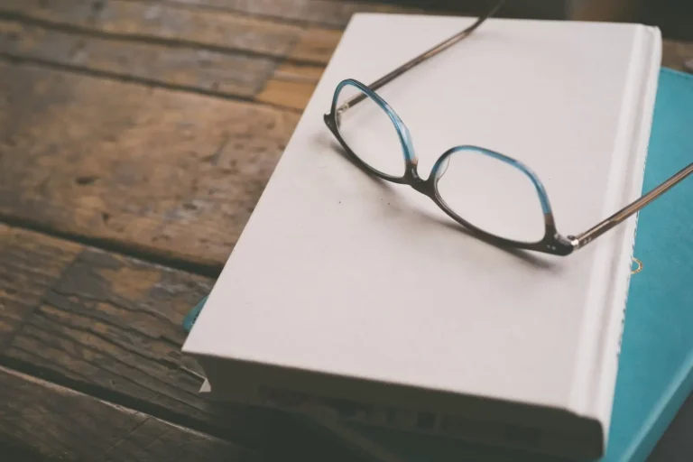 Glasses on a closed book