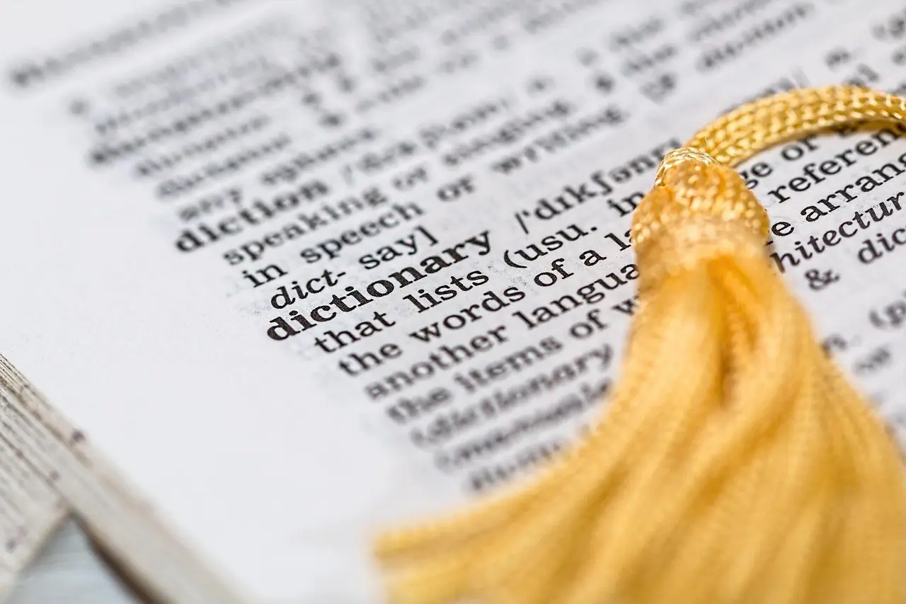 Dictionary page with a gold tassel bookmark